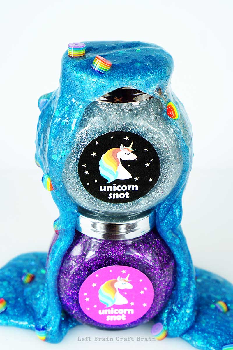 Glittery, sparkly, unicorn snot slime, complete with rainbow boogers. Why? Because unicorns. Plus a free printable label and tag!