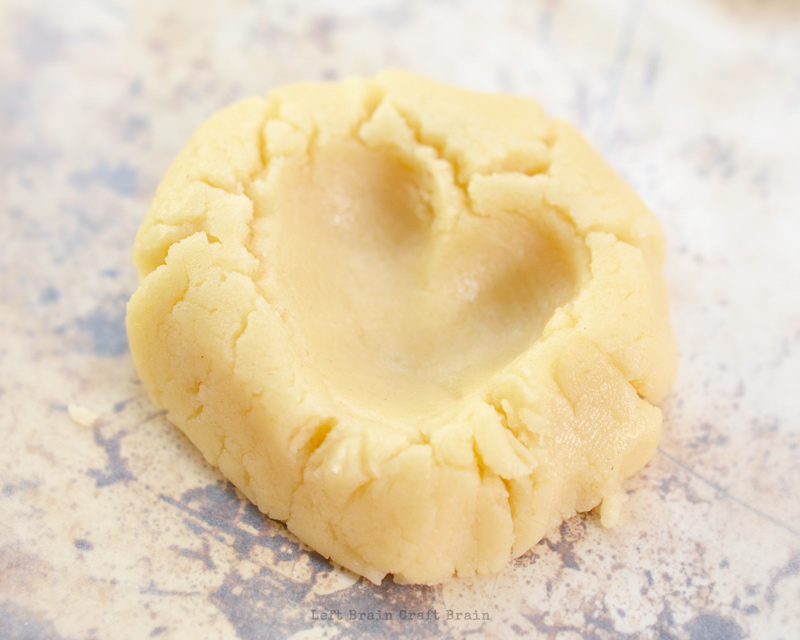 make a v shaped impression in cookie dough with finger