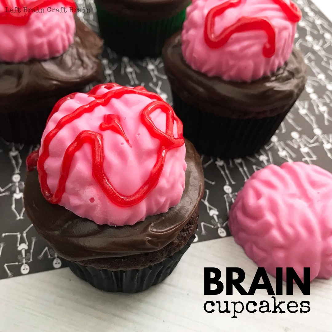 Bake these spooky Brain Halloween Cupcakes for your next Halloween party or zombie gathering. They're deliciously chocolate and easy to make with your favorite cake recipe or boxed cake mix. All you need is a brain mold, some candy melts, and red gel icing. these treats will add some scary sweet to your party table.