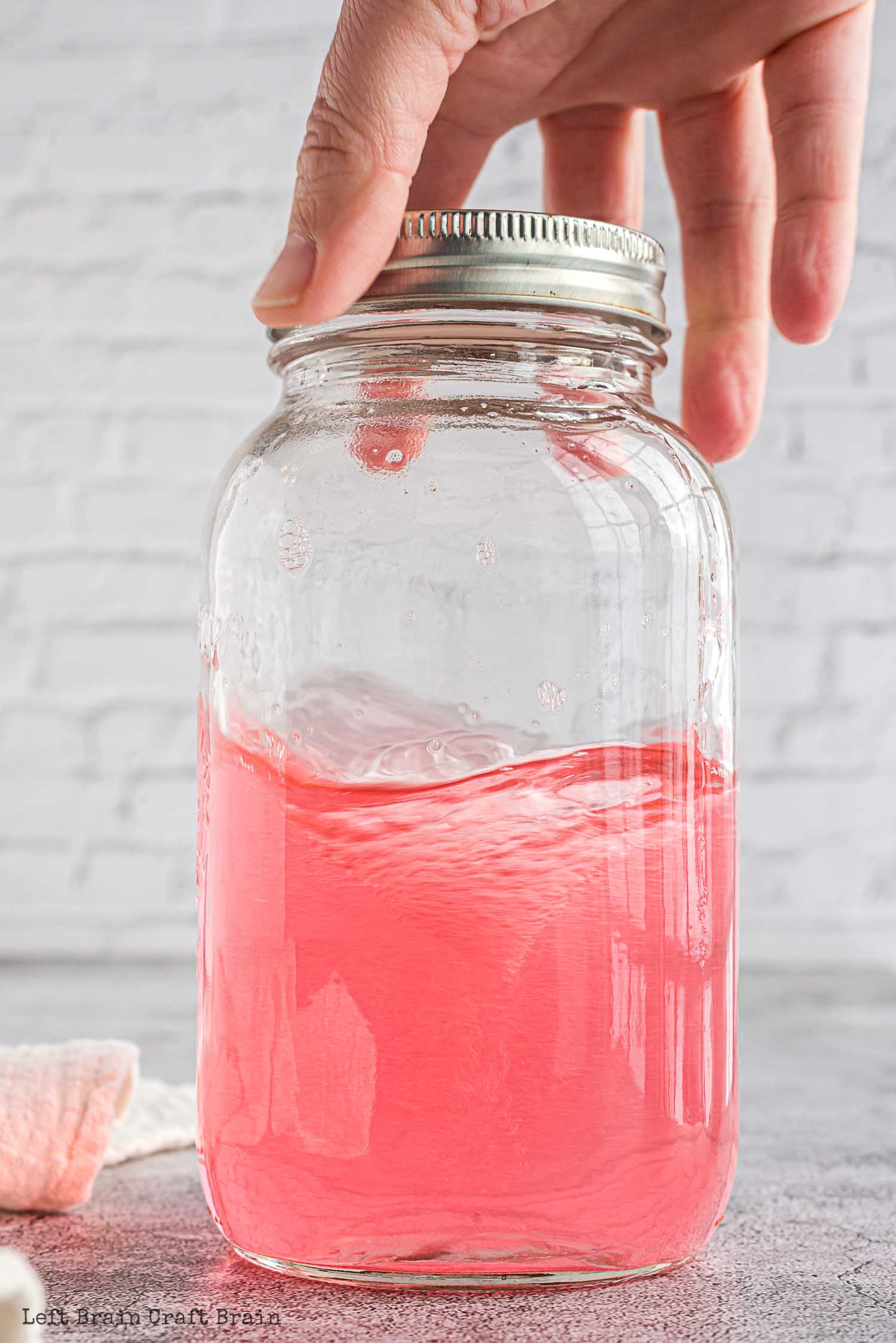 spinning tornado in a jar with pink water