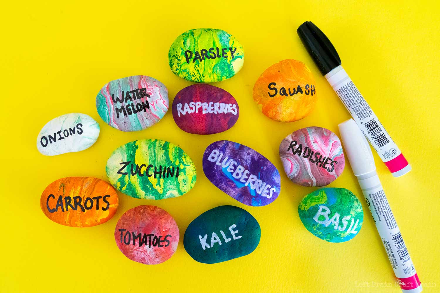 lots of labeled pour painted rock garden markers with paint pens