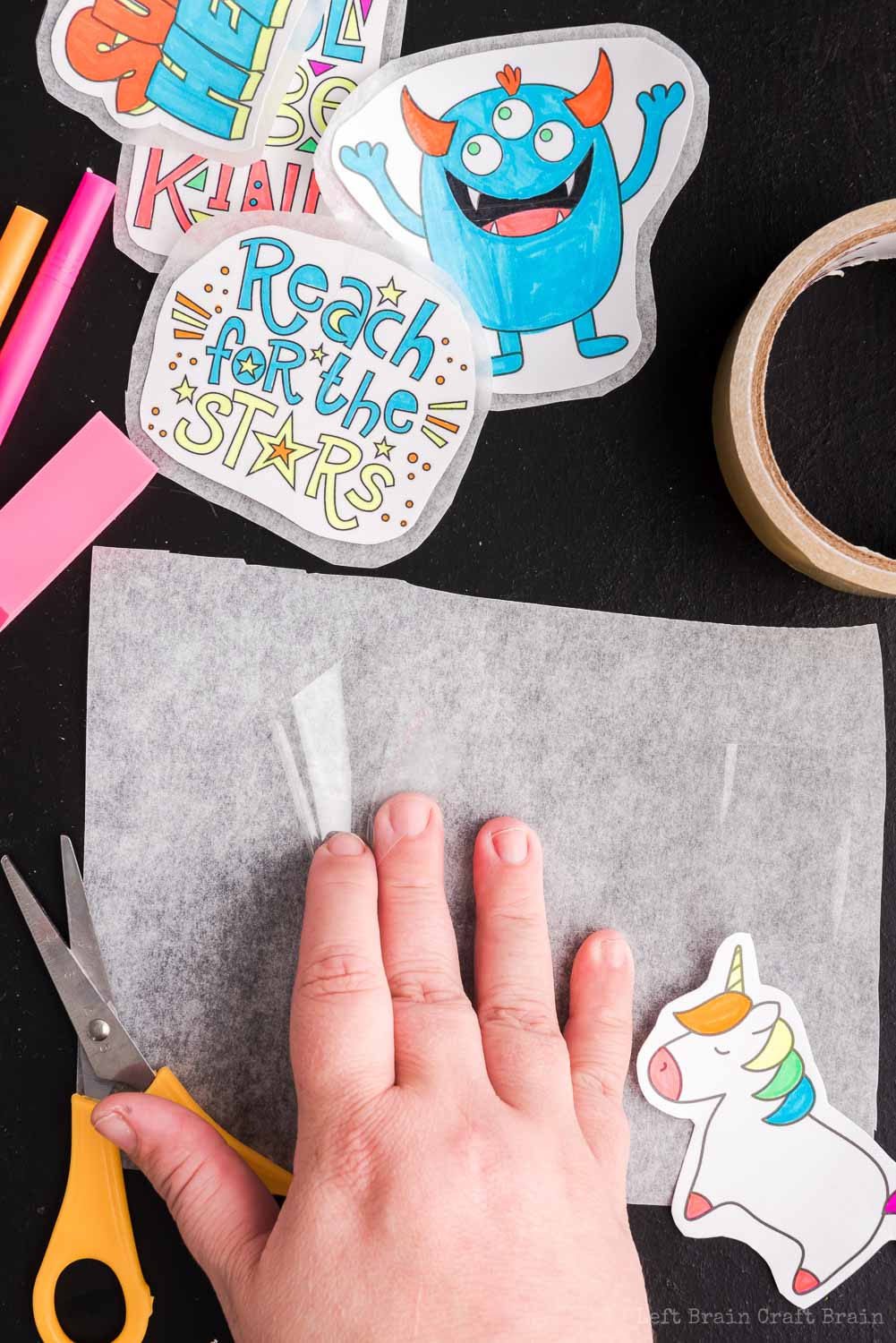 Place first layer of tape for stickers - Make your own DIY stickers with a super easy process using basic supplies. Kids will love this activity. They're fun to add to presents, too.