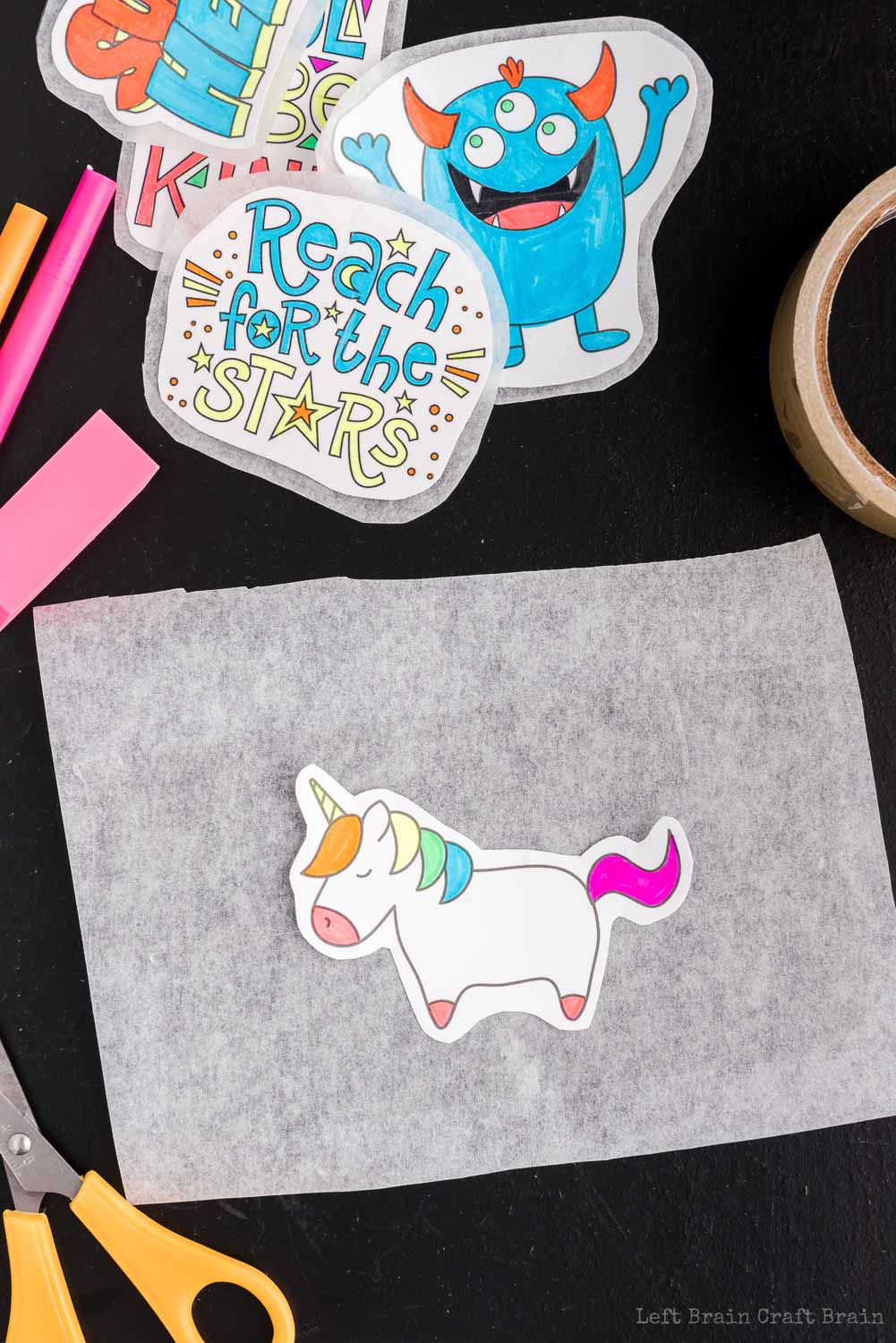 Lay design on tape - Make your own DIY stickers with a super easy process using basic supplies. Kids will love this activity. They're fun to add to presents, too.